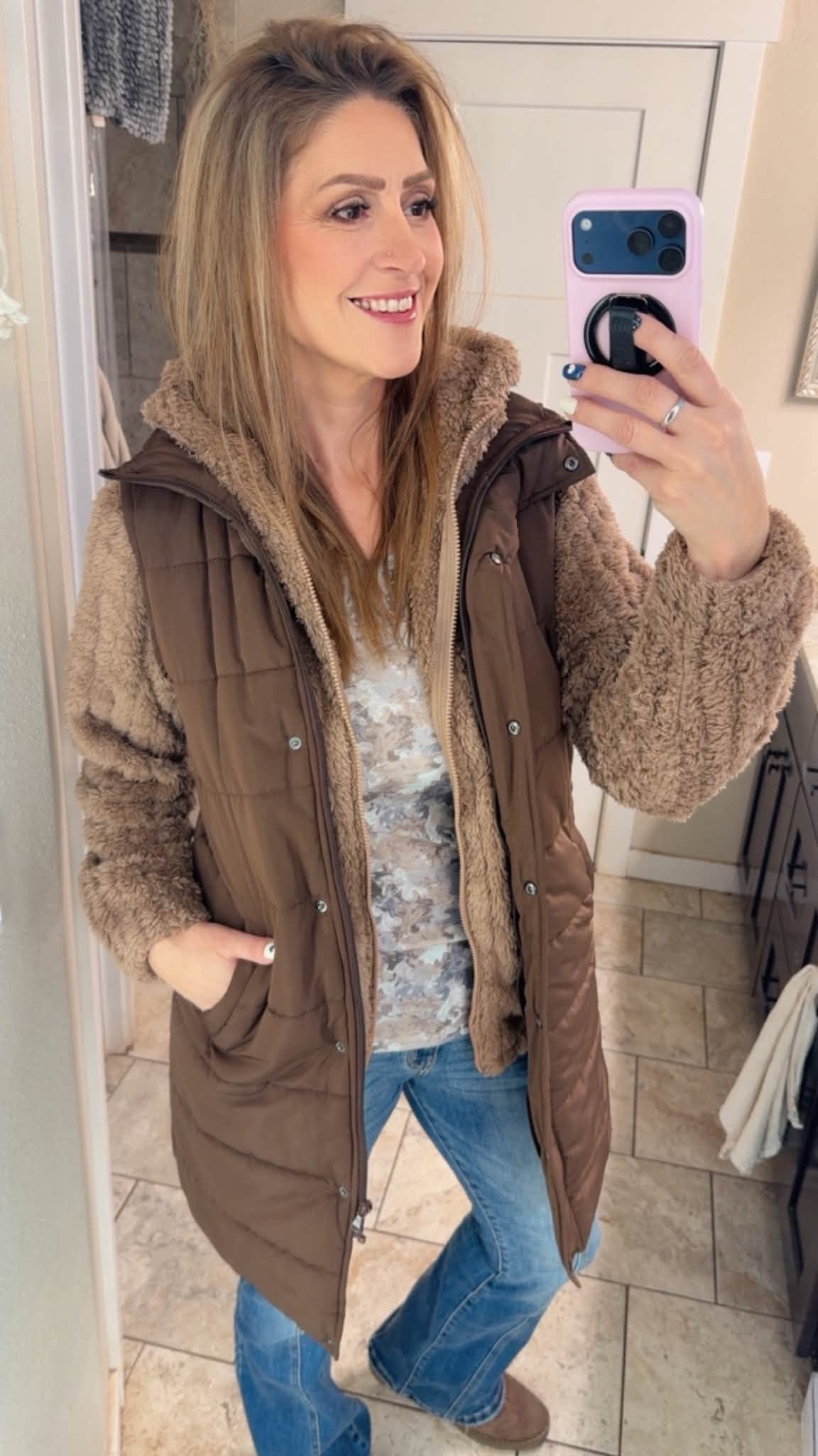 Amy wearing the Cozy Era sherpa puffer vest